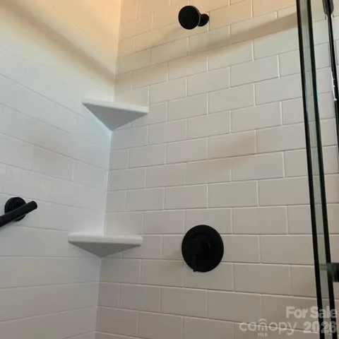 an aerial view of residential house with outdoor space and parking