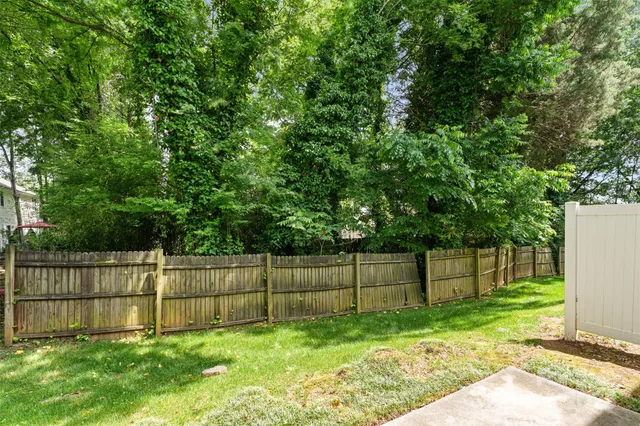 a view of a swimming pool and deck in the backyard of house