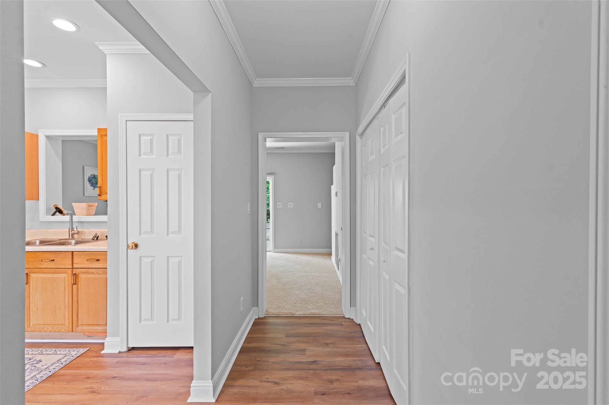 7019 Walnut Ridge Court Charlotte, NC 28273 - Photo 3 of 29 a view of a hallway with wooden floor and closet