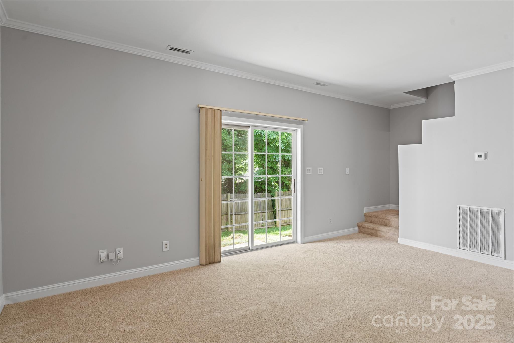 7019 Walnut Ridge Court Charlotte, NC 28273 - Photo 5 of 29 a view of an empty room with a window