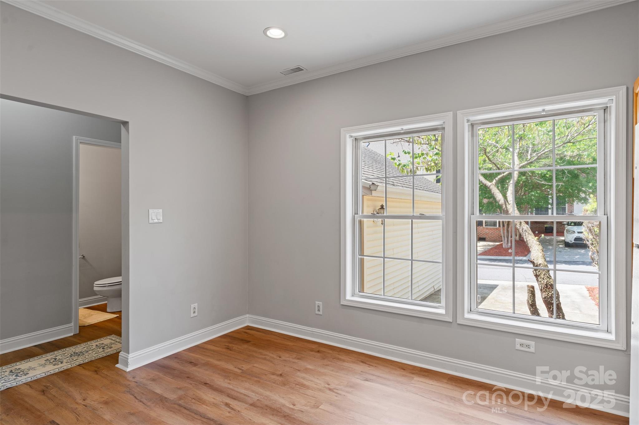 7019 Walnut Ridge Court Charlotte, NC 28273 - Photo 8 of 29 an empty room with wooden floor and windows