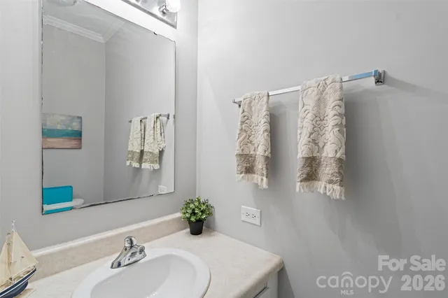 a bathroom with a toilet a sink and shower