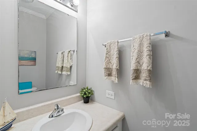 a bathroom with a toilet a sink and shower