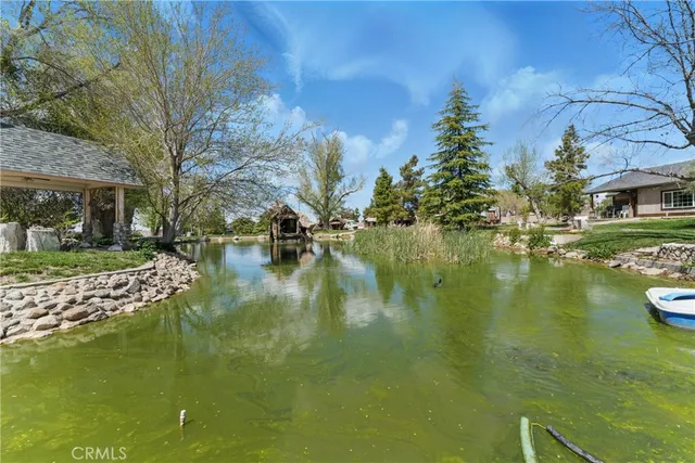 a view of a water fountain in front of house