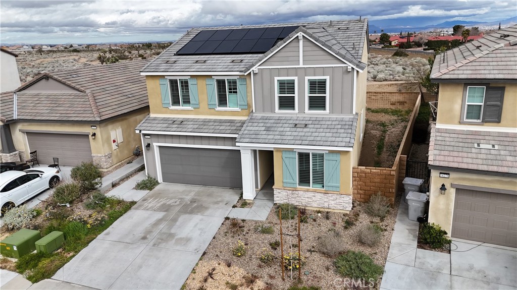 14270 Hercules Street Hesperia, CA 92345 - Photo 2 of 46 a front view of a house with a yard