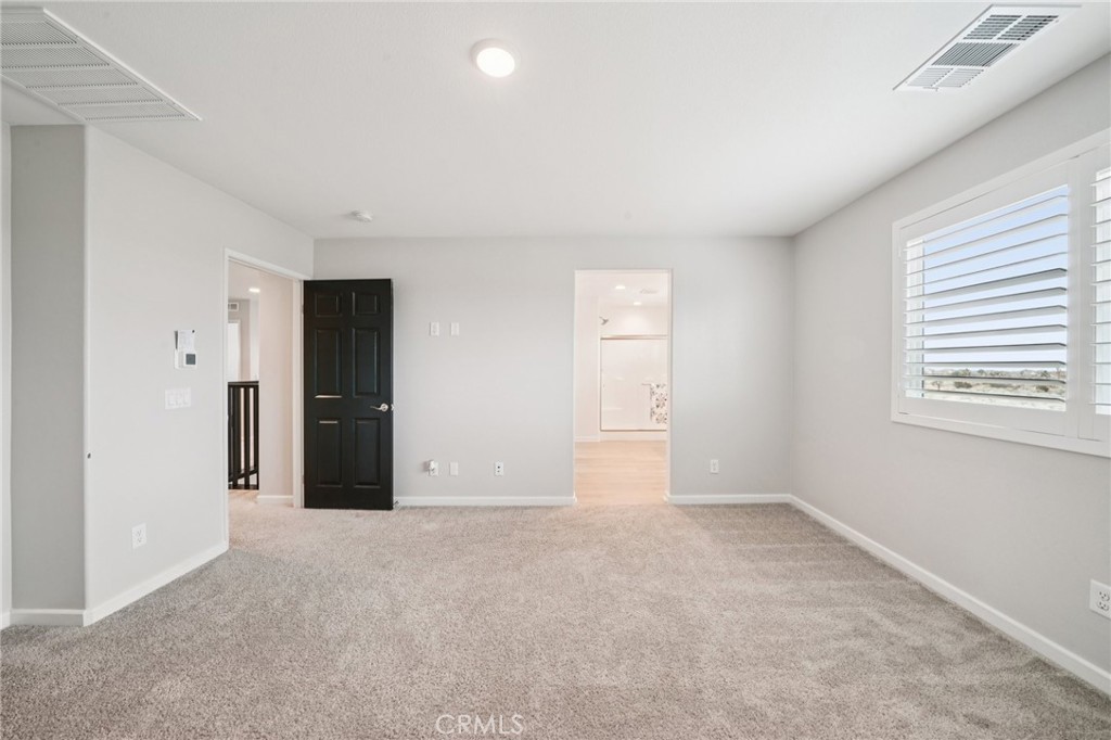 14270 Hercules Street Hesperia, CA 92345 - Photo 30 of 46 an empty room with windows