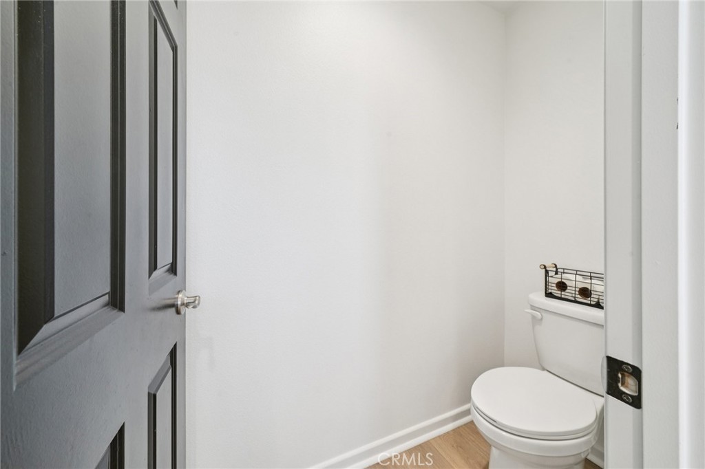 14270 Hercules Street Hesperia, CA 92345 - Photo 33 of 46 a white toilet sitting next to a shower