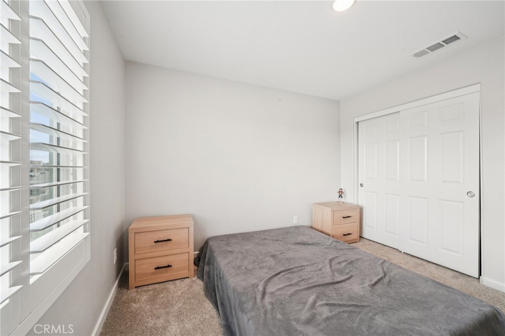 14270 Hercules Street Hesperia, CA 92345 - Photo 41 of 46 a bedroom with a bed and a window