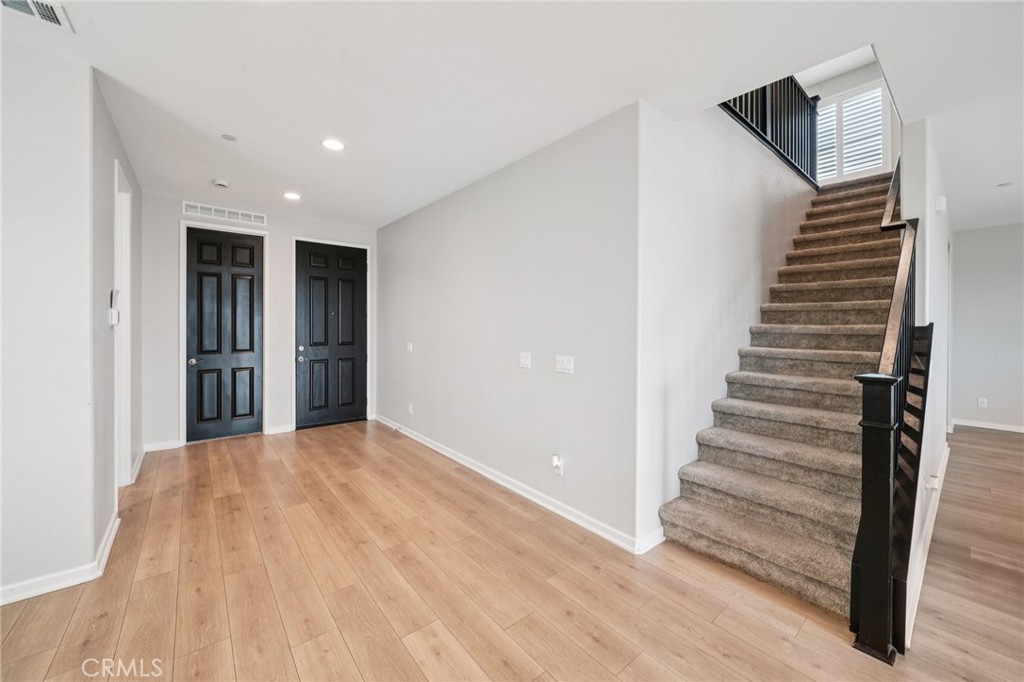 14270 Hercules Street Hesperia, CA 92345 - Photo 7 of 46 a view of entryway with wooden floor