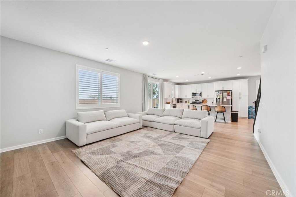 14270 Hercules Street Hesperia, CA 92345 - Photo 9 of 46 a living room with furniture and a wooden floor