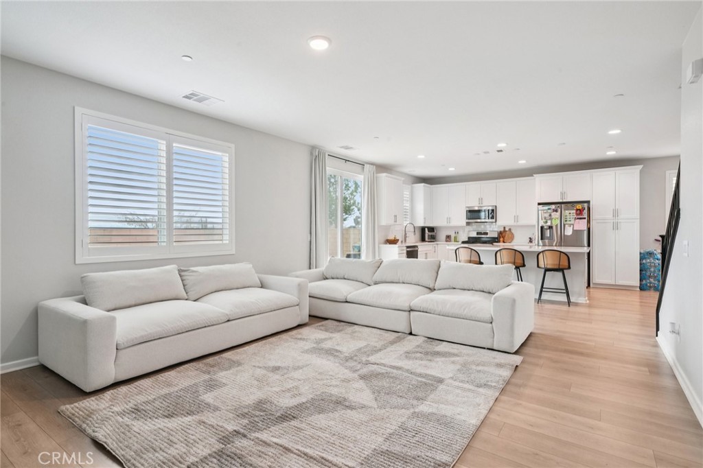 14270 Hercules Street Hesperia, CA 92345 - Photo 10 of 46 a living room with furniture and a large window