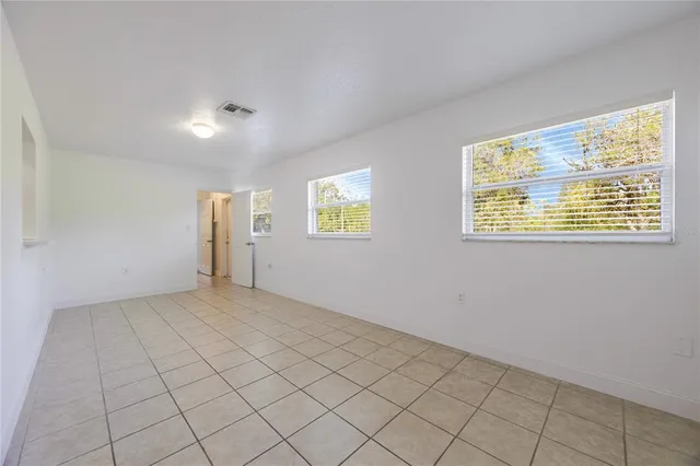 a view of a hallway to closet and natural light
