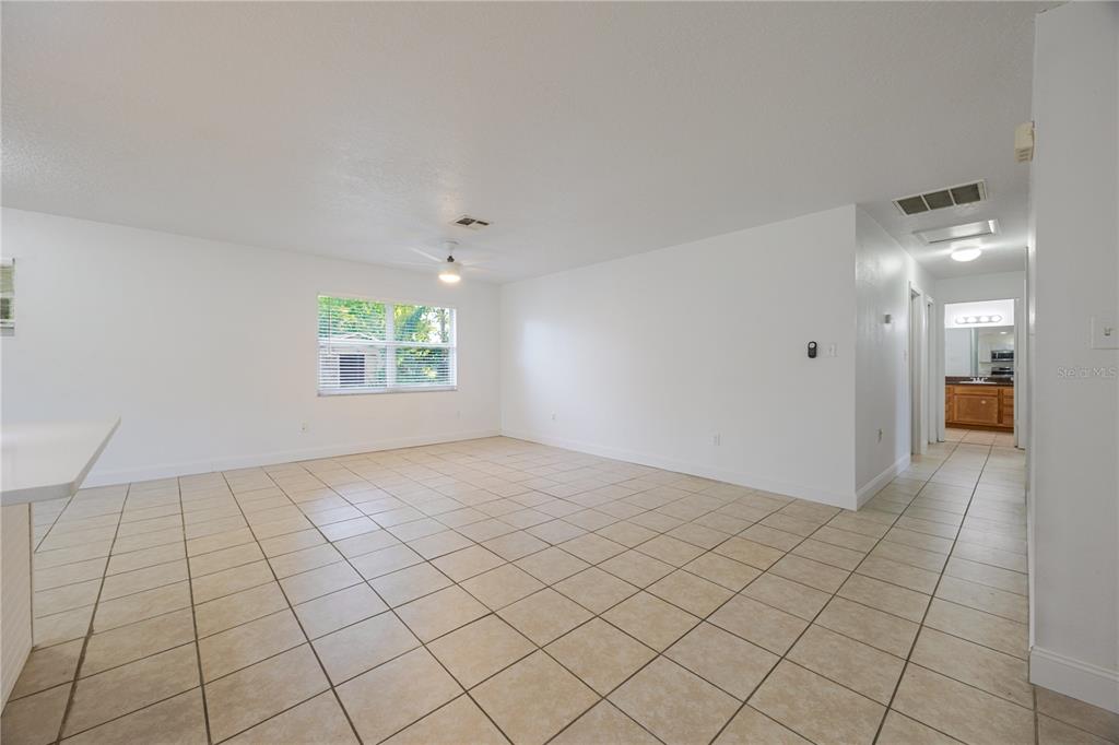 495 Orange Avenue St. Cloud, FL 34769 - Photo 6 of 32 a view of an empty room and window