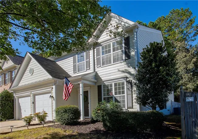 a front view of a house with garden