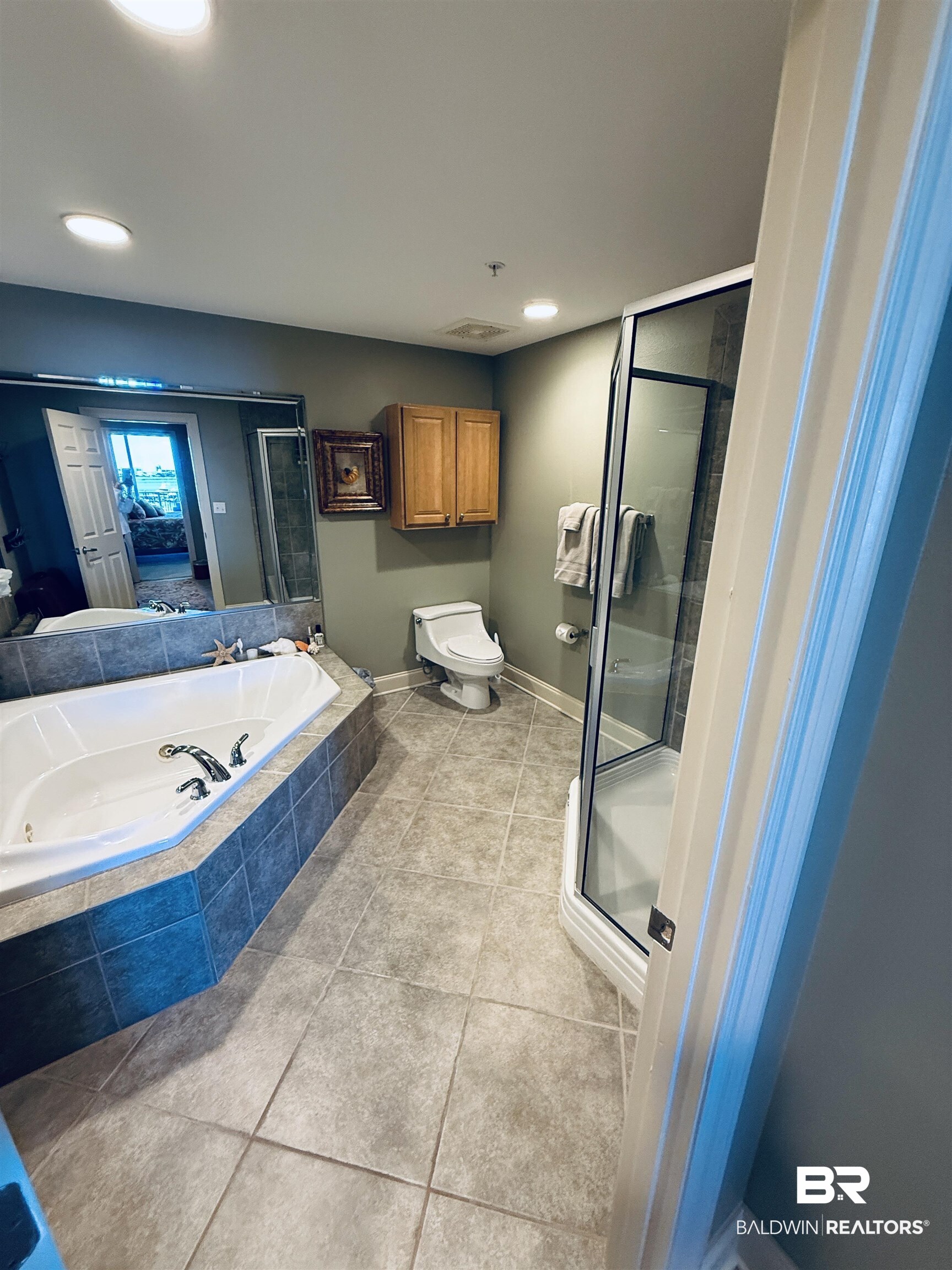 27800 Canal Road, Unit 409 Orange Beach, AL 36561 - Photo 18 of 22 Full bath featuring a stall shower, a tub with jets, light tile patterned floors, and recessed lighting