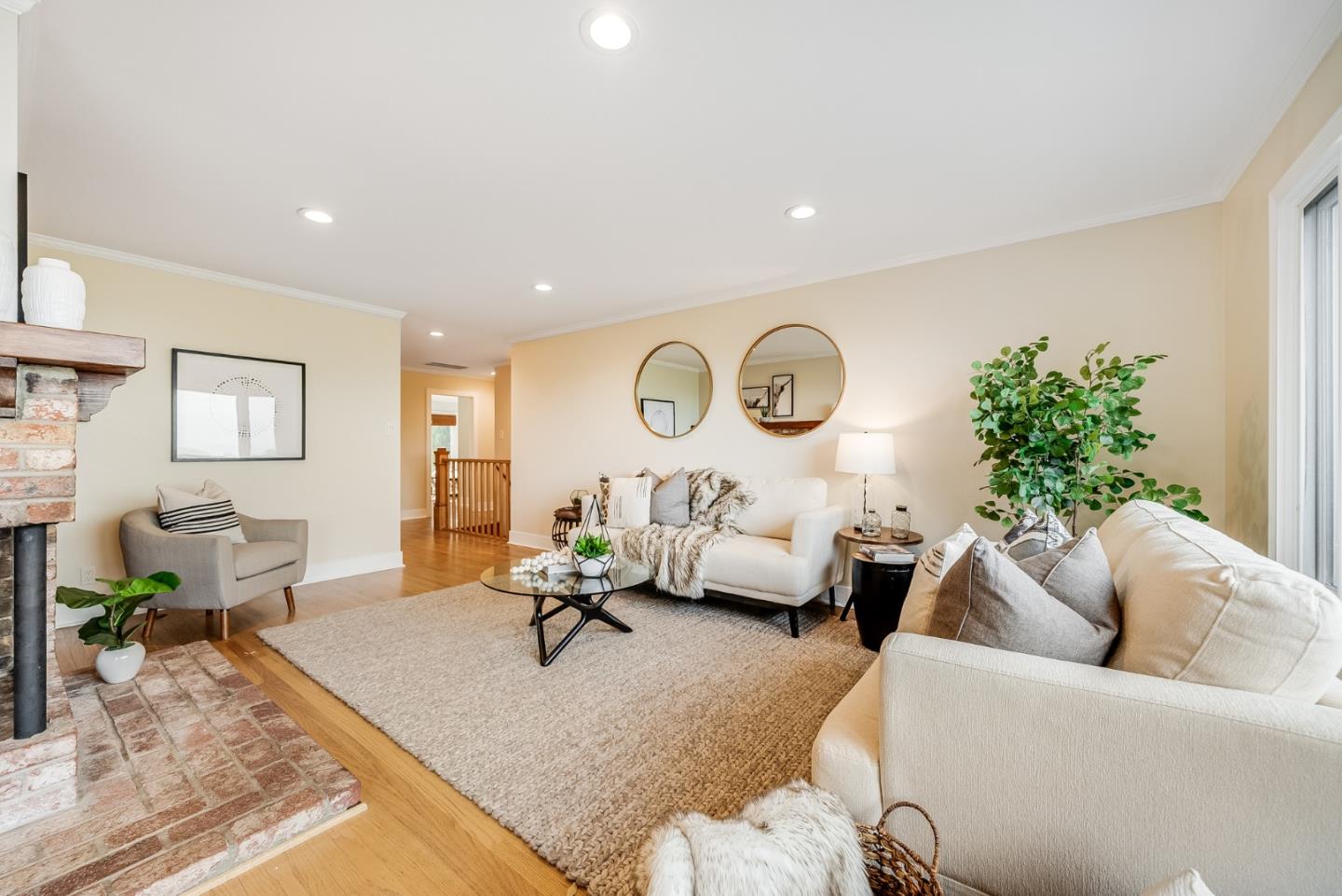 2211 Ewell Road Belmont, CA 94002 - Photo 11 of 44 a living room with furniture potted plant and white walls