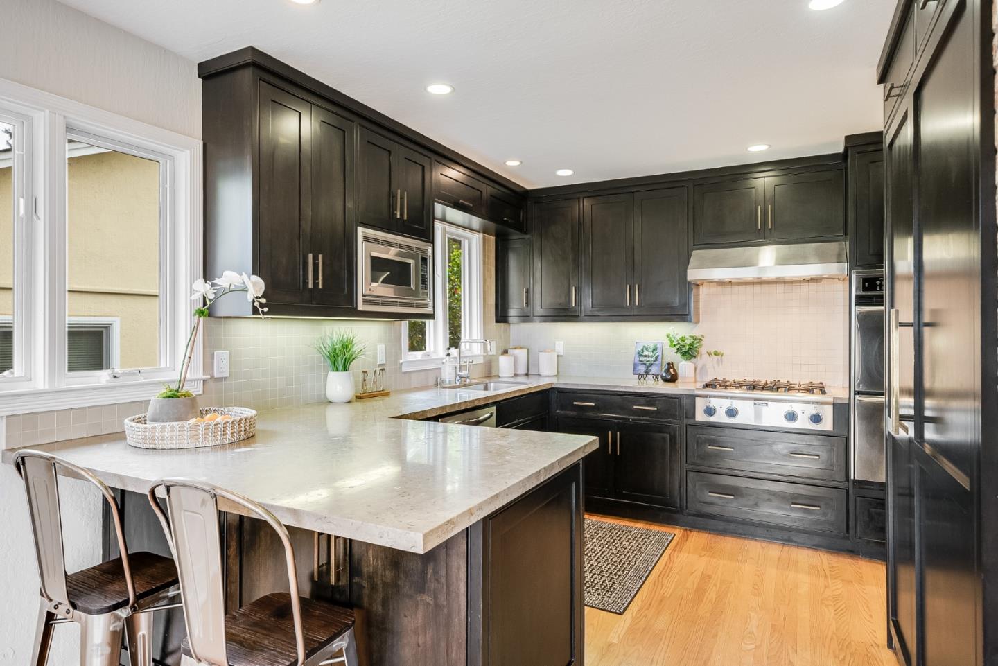 2211 Ewell Road Belmont, CA 94002 - Photo 14 of 44 a kitchen with stainless steel appliances granite countertop a stove a sink and a refrigerator