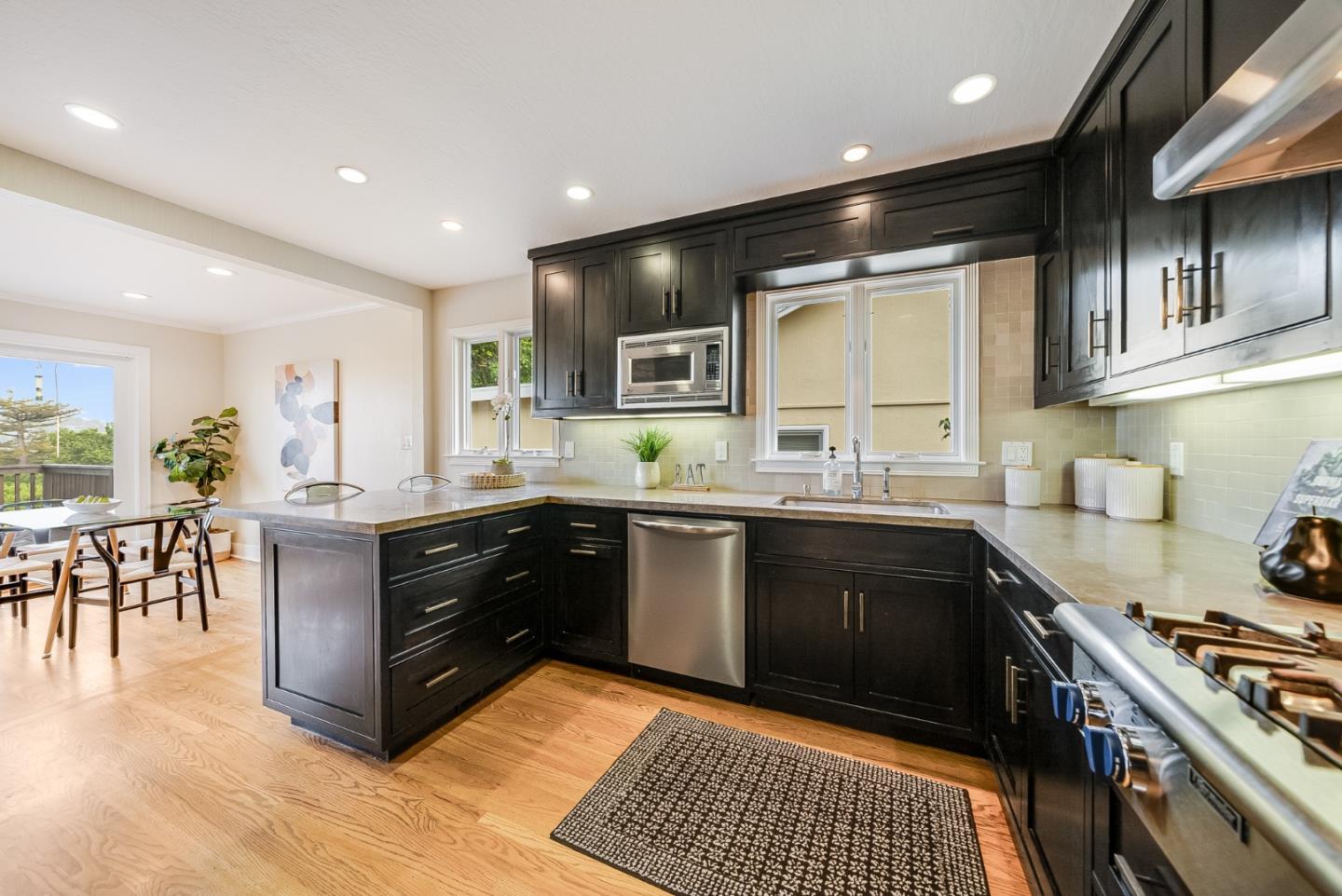 2211 Ewell Road Belmont, CA 94002 - Photo 16 of 44 a kitchen with stainless steel appliances granite countertop a stove a sink a refrigerator and a microwave