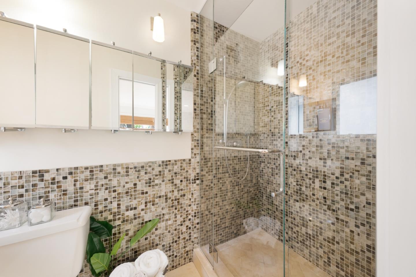 2211 Ewell Road Belmont, CA 94002 - Photo 19 of 44 a bathroom with a shower toilet and a sink