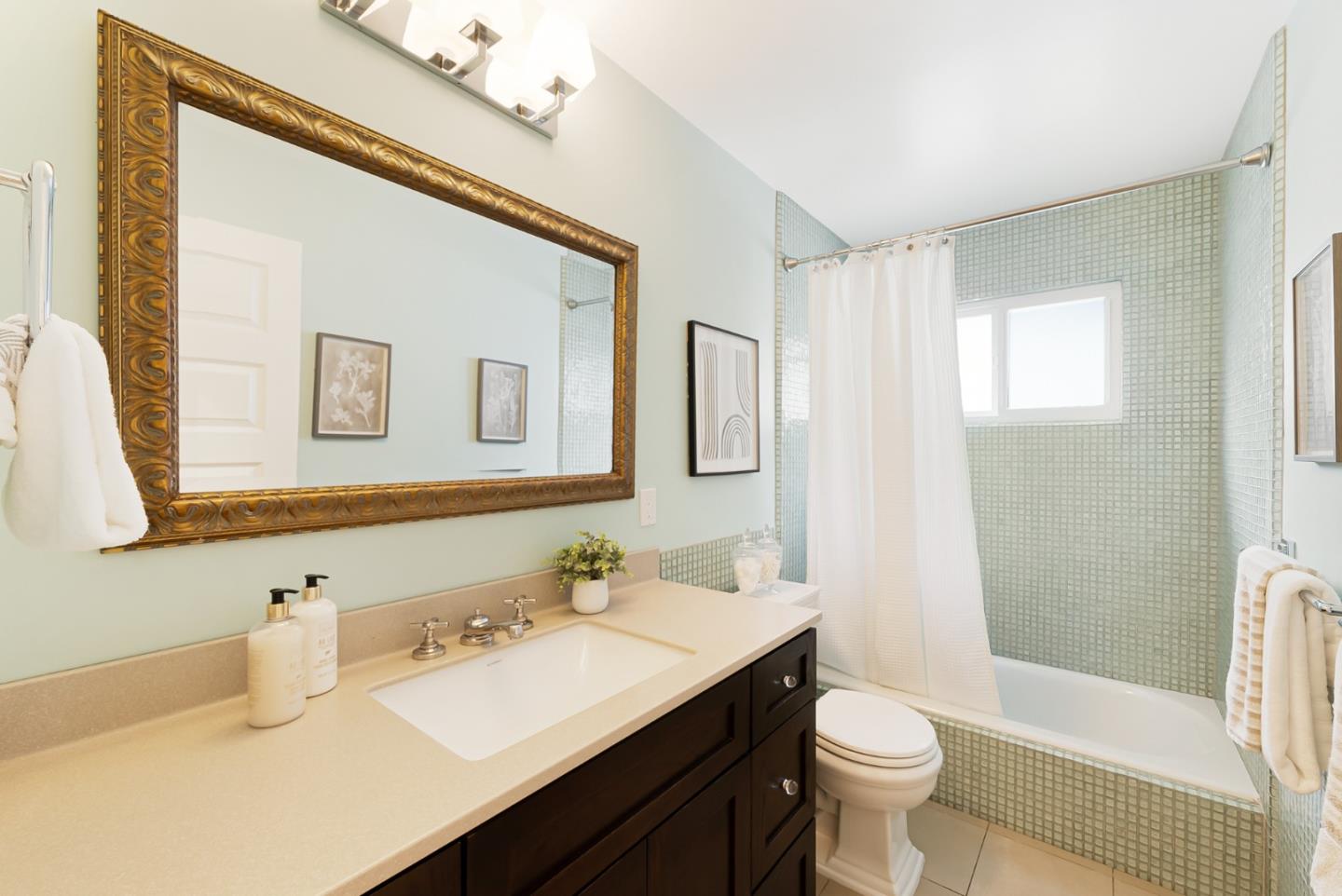 2211 Ewell Road Belmont, CA 94002 - Photo 21 of 44 a bathroom with a sink a toilet and shower