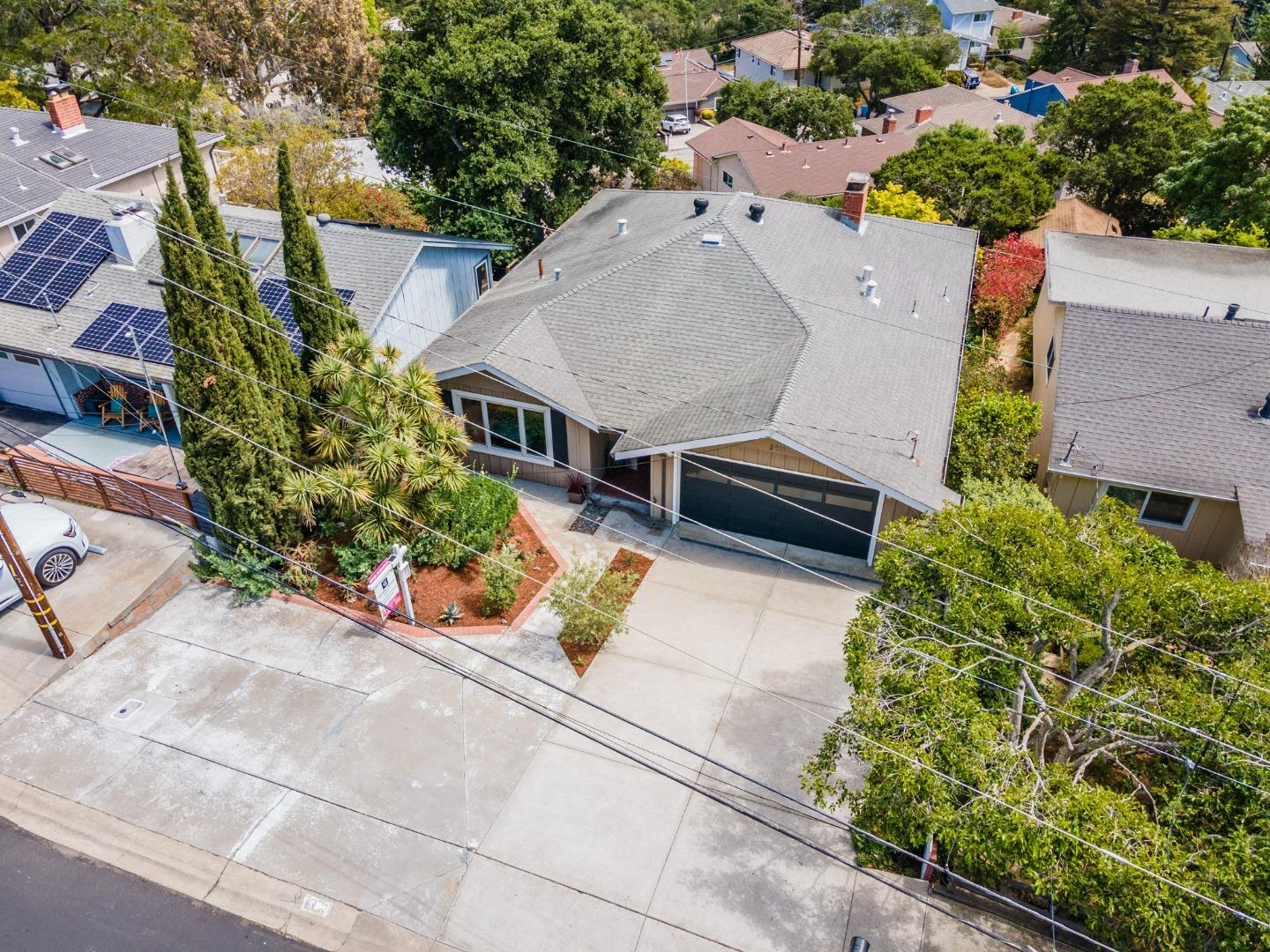 2211 Ewell Road Belmont, CA 94002 - Photo 40 of 44 an aerial view of a house with a yard and large trees
