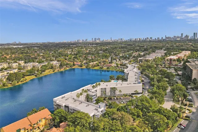 a view of a dining room with furniture and a potted plant