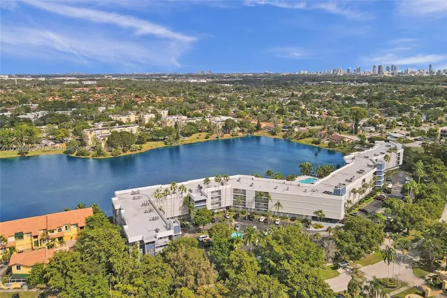 a livingroom with furniture and a entryway