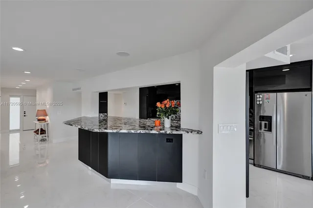 a bed sitting in a room next to a window