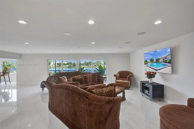 a view of room with window and wooden floor