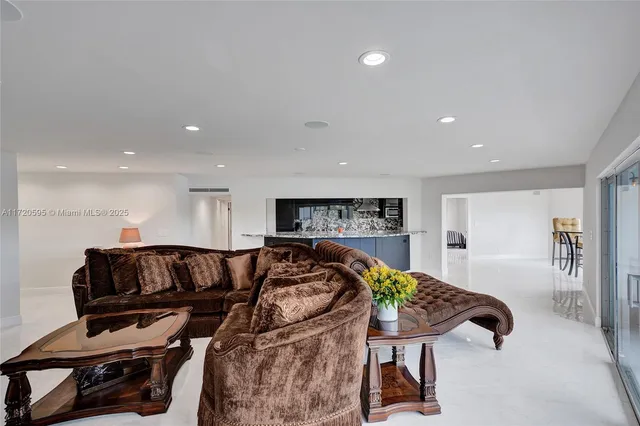 a bathroom with a granite countertop sink mirror toilet and bathtub
