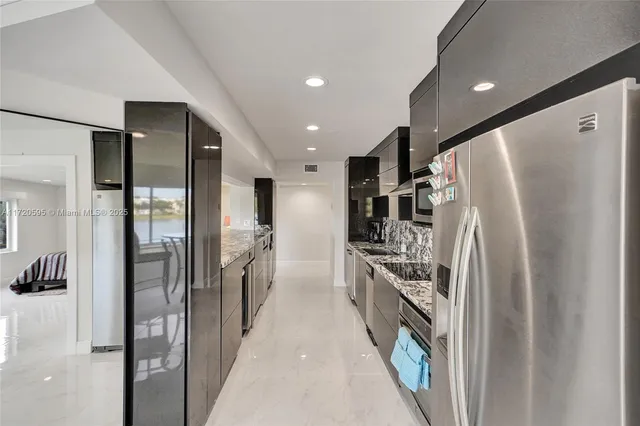 a bathroom with a granite countertop sink mirror and toilet