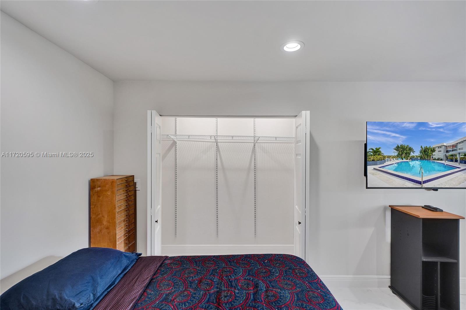 877 Northeast 195th Street, Unit 222 Miami, FL 33179 - Photo 58 of 93 a view of room with window and wooden floor