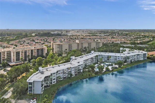 an aerial view of a house with a ocean view