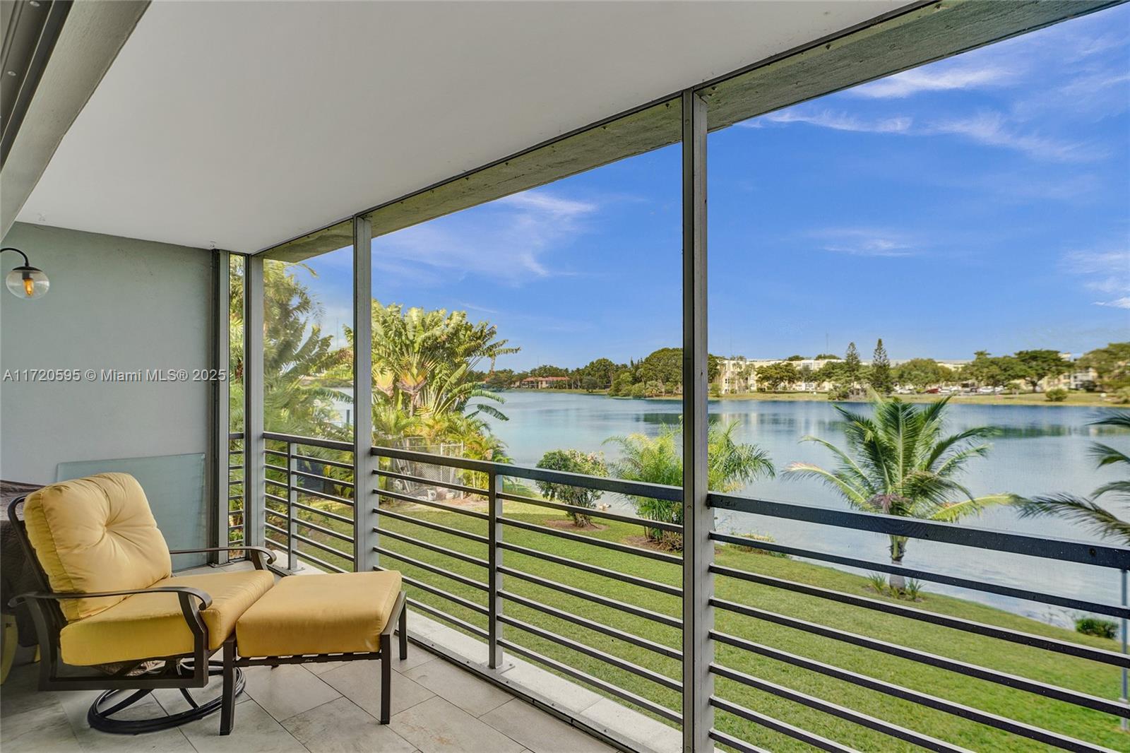 877 Northeast 195th Street, Unit 222 Miami, FL 33179 - Photo 70 of 93 a view of a balcony with chair and table