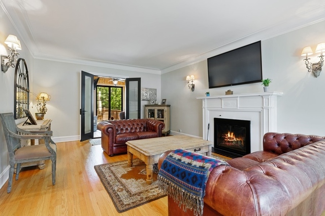 11 Wisner Street Park Ridge, IL 60068 - Photo 4 of 29 a living room with furniture a flat screen tv and a fireplace
