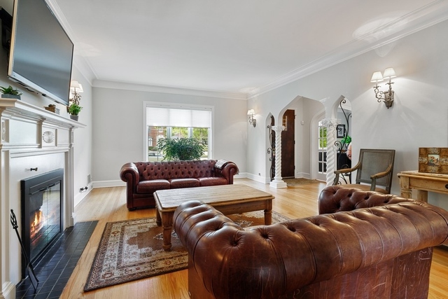 11 Wisner Street Park Ridge, IL 60068 - Photo 5 of 29 a living room with furniture a fireplace and a flat screen tv