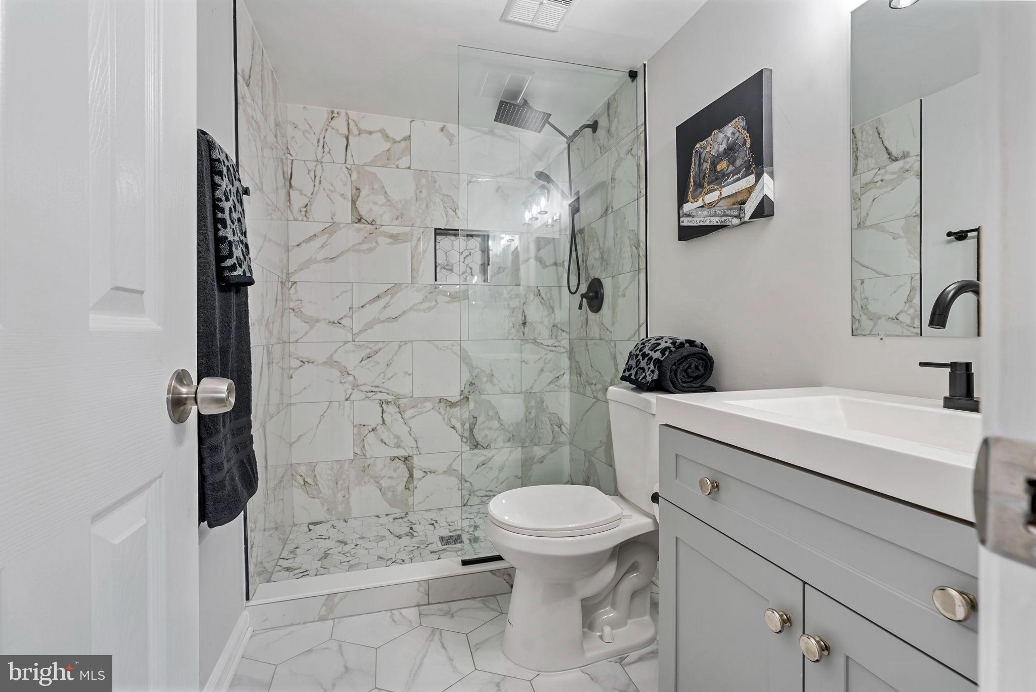 790 Quince Orchard Boulevard, Unit 202 Gaithersburg, MD 20878 - Photo 12 of 25 Primary ensuite with gorgeous porcelain tile
