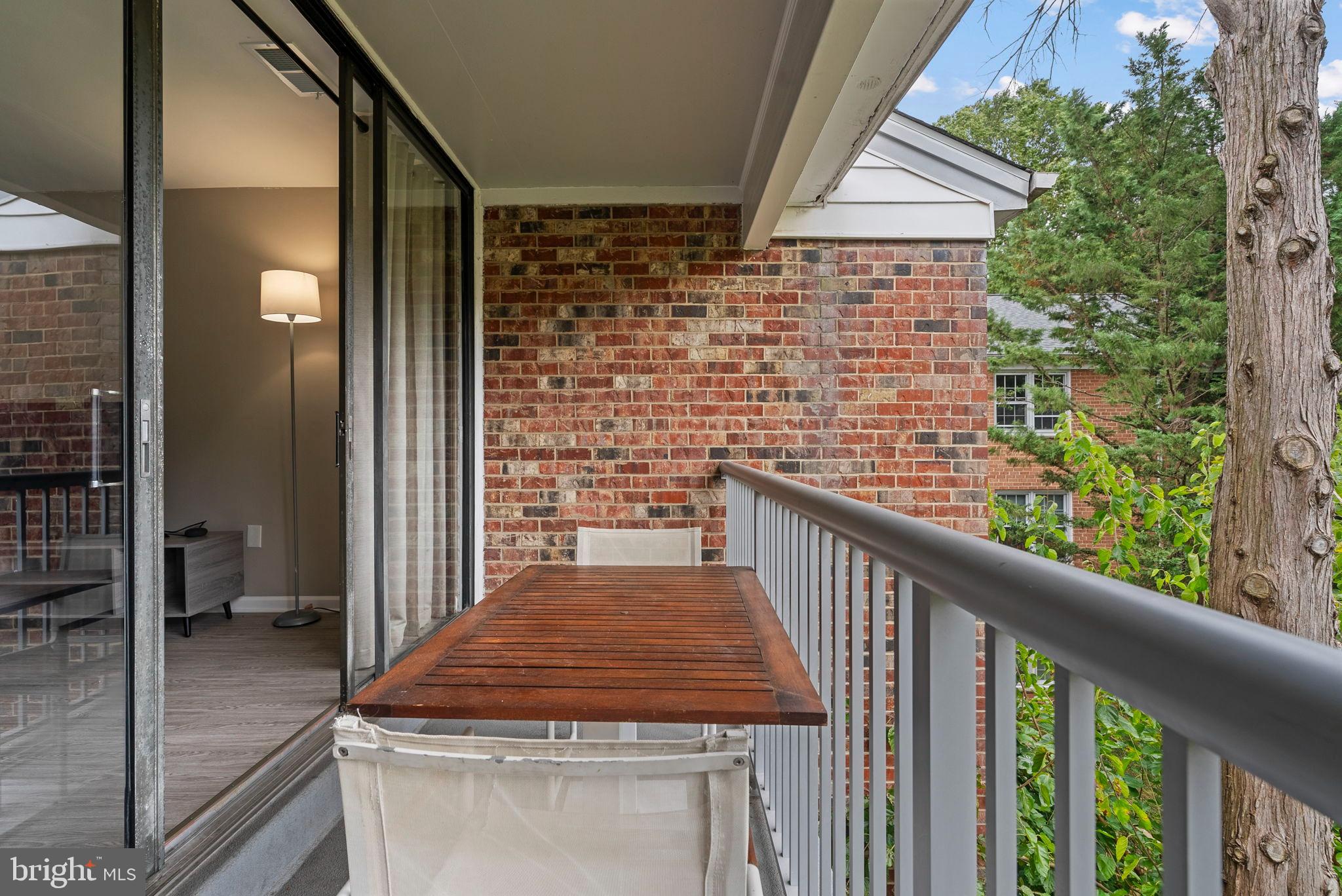 790 Quince Orchard Boulevard, Unit 202 Gaithersburg, MD 20878 - Photo 24 of 25 Charming balcony with serene views.