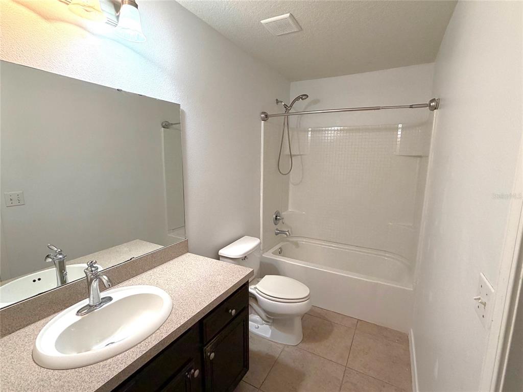 1376 Seburn Road Apopka, FL 32703 - Photo 23 of 32 a bathroom with a sink toilet and shower
