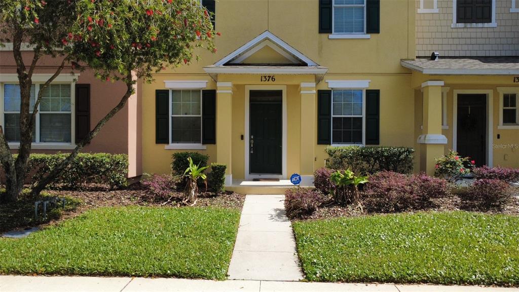 1376 Seburn Road Apopka, FL 32703 - Photo 4 of 32 a front view of a house with a yard