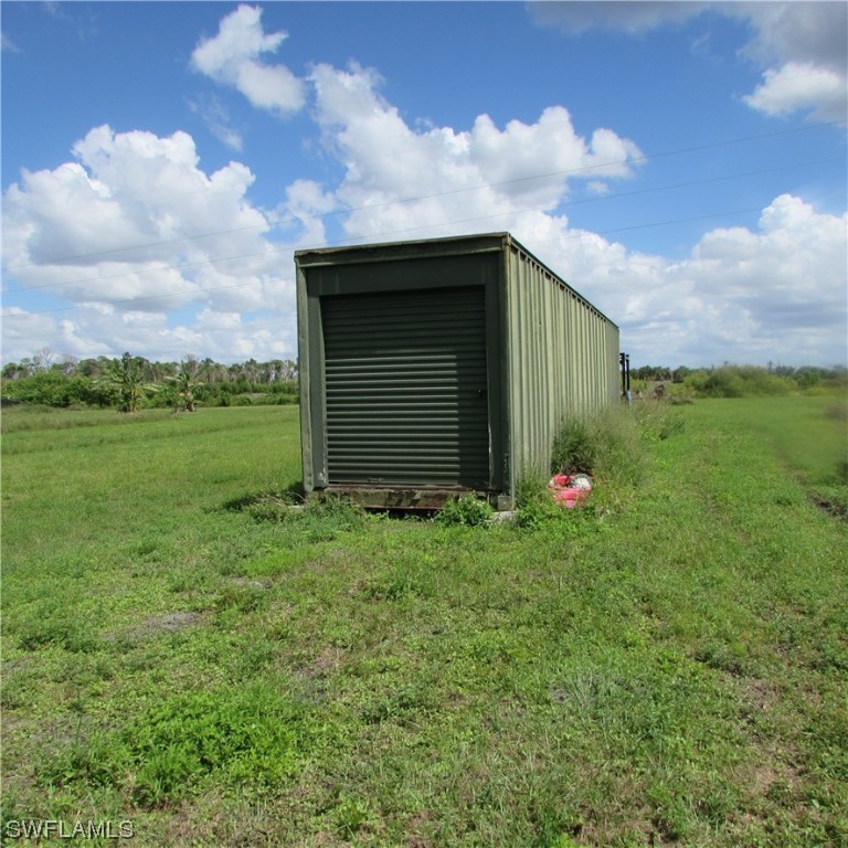 6700 Stringfellow Road St. James City, FL 33956 - Photo 23 of 25 a backyard of a house with lots of green space