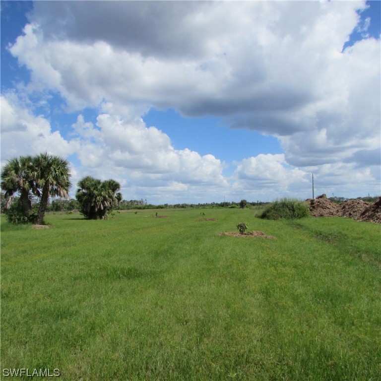 6700 Stringfellow Road St. James City, FL 33956 - Photo 7 of 25 a view of a garden and basketball court