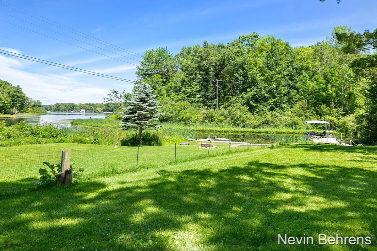 5396 Centerline Road Newaygo, MI 49337 - Photo 19 of 20 5396 Centerline Lake side-outside fence