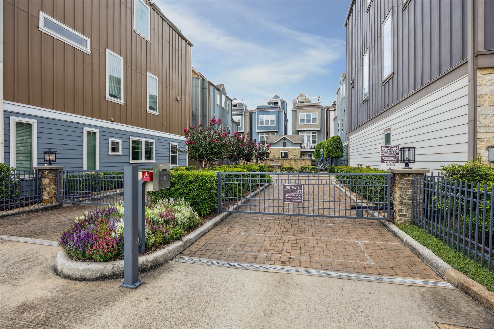 739 Dorothy Street Houston, TX 77007 - Photo 21 of 30 A controlled-access gate and brick-paved drive lead into this secure community, offering both privacy and peace of mind. Well-kept landscaping and charming architecture line the path to the homes, reinforcing a sense of pride in ownership.