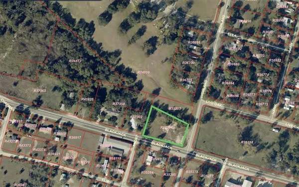 an aerial view of a residential apartment building with parking space