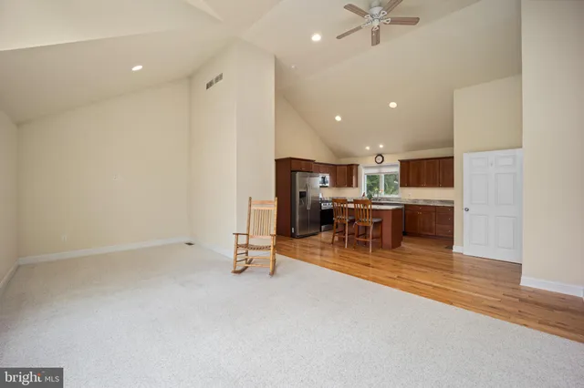 a view of a room with chairs and table