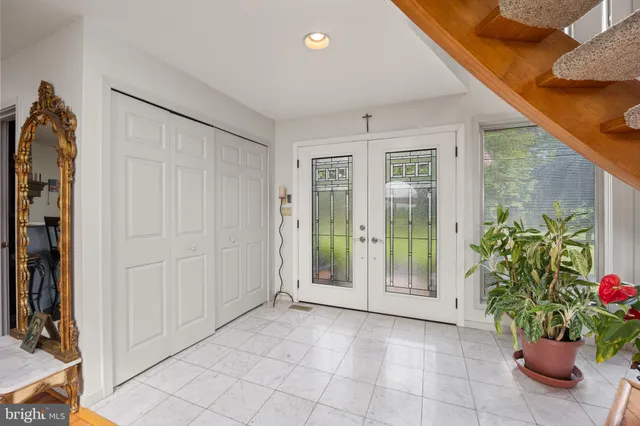 a view of an entryway with flower and garden