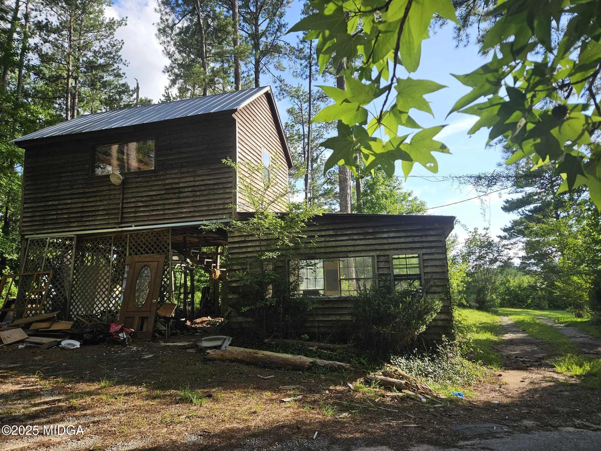 156 Rose Down Avenue Gray, GA 31032 - Photo 12 of 46 a view of a house with a tree