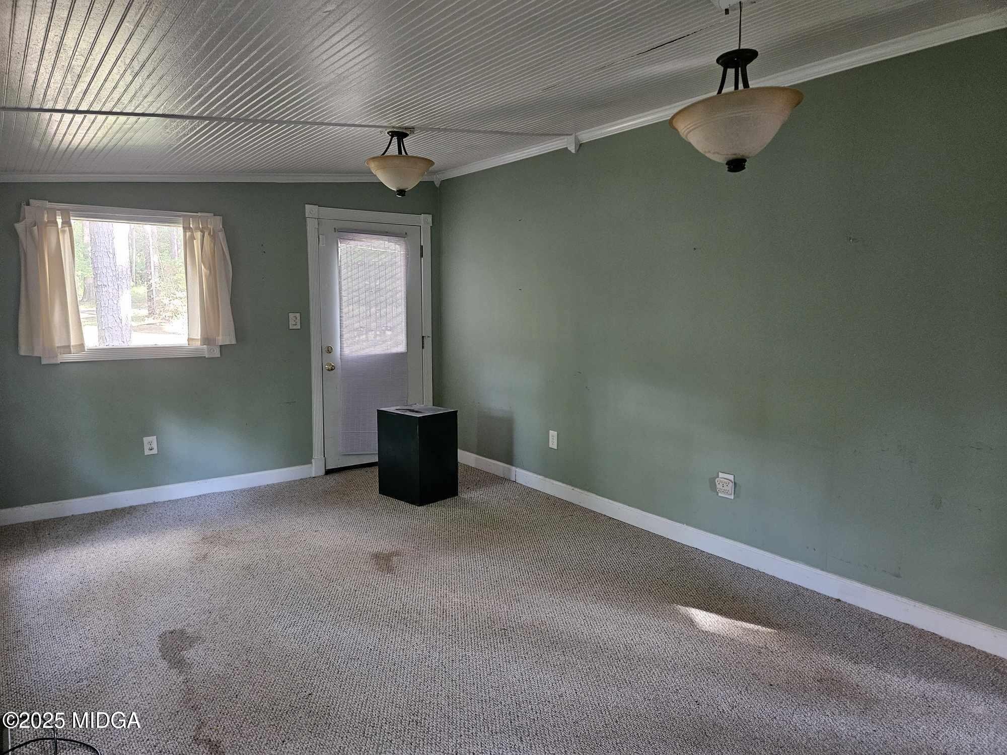 156 Rose Down Avenue Gray, GA 31032 - Photo 29 of 46 an empty room with windows and fan