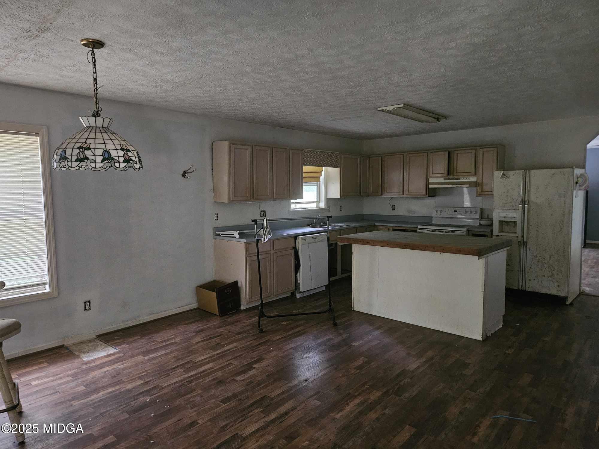 156 Rose Down Avenue Gray, GA 31032 - Photo 40 of 46 a kitchen with stainless steel appliances granite countertop a stove a sink dishwasher and a refrigerator